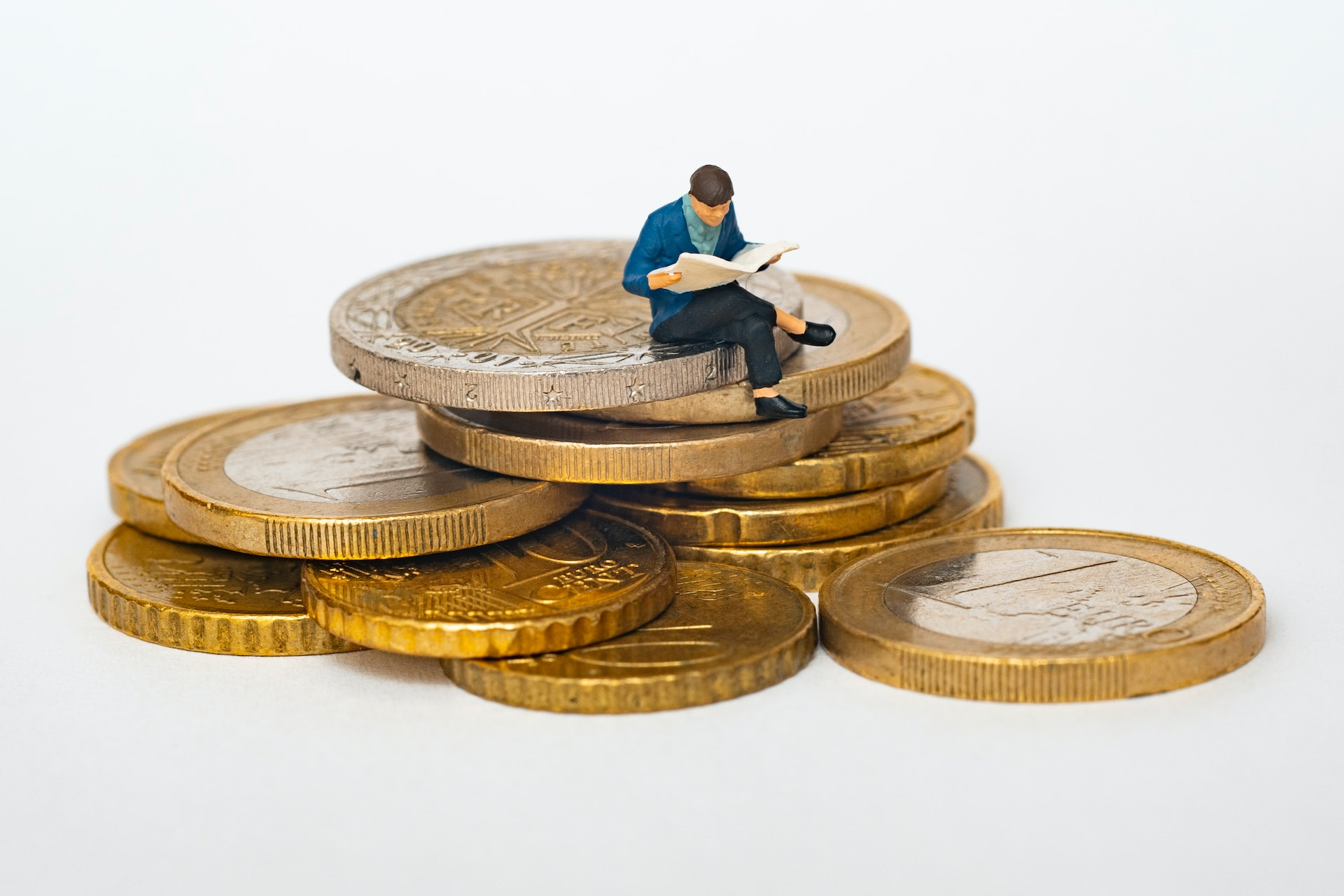 Small man on money saved by using freelance copywriter for marketing for blog post