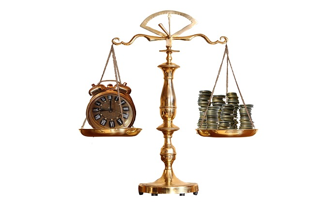 Time and money on a weighing scale in a blog about starting a blog as one of the marketing strategies to get more website visitors