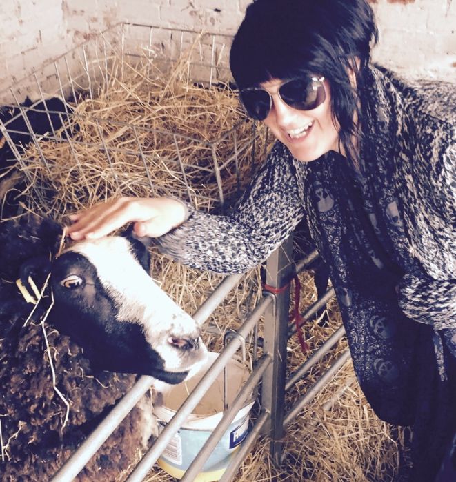 Pixie Greatorex, freelance pet blog writer with a cow