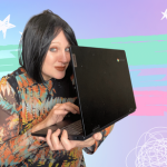 Blog 1-2-1 training coach Pixie Greatorex holding laptop