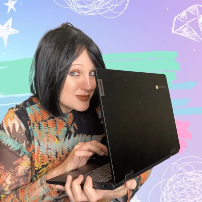 Pet blog writer Pixie Greatorex, holding a laptop